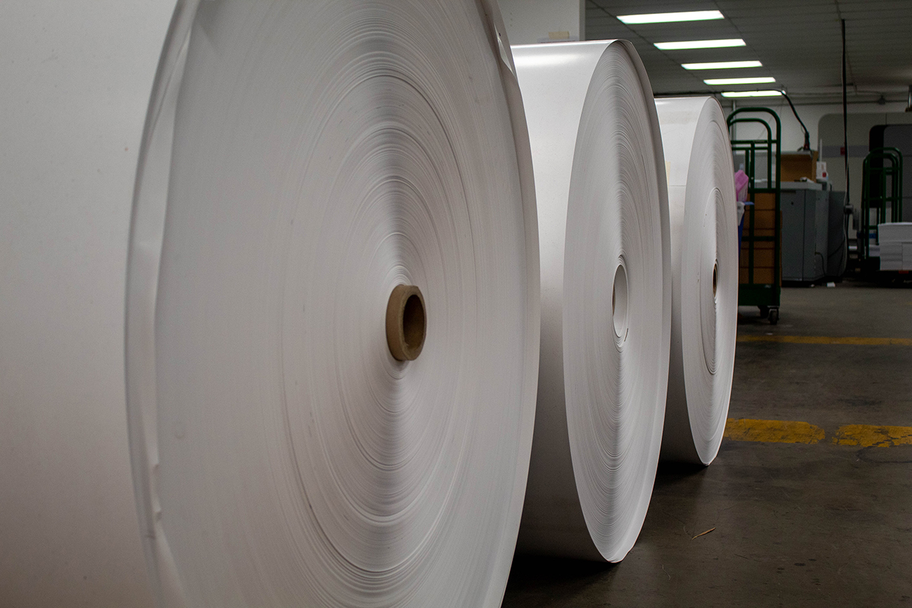 3 rolls of large paper that is put on even larger printers to print direct mail.