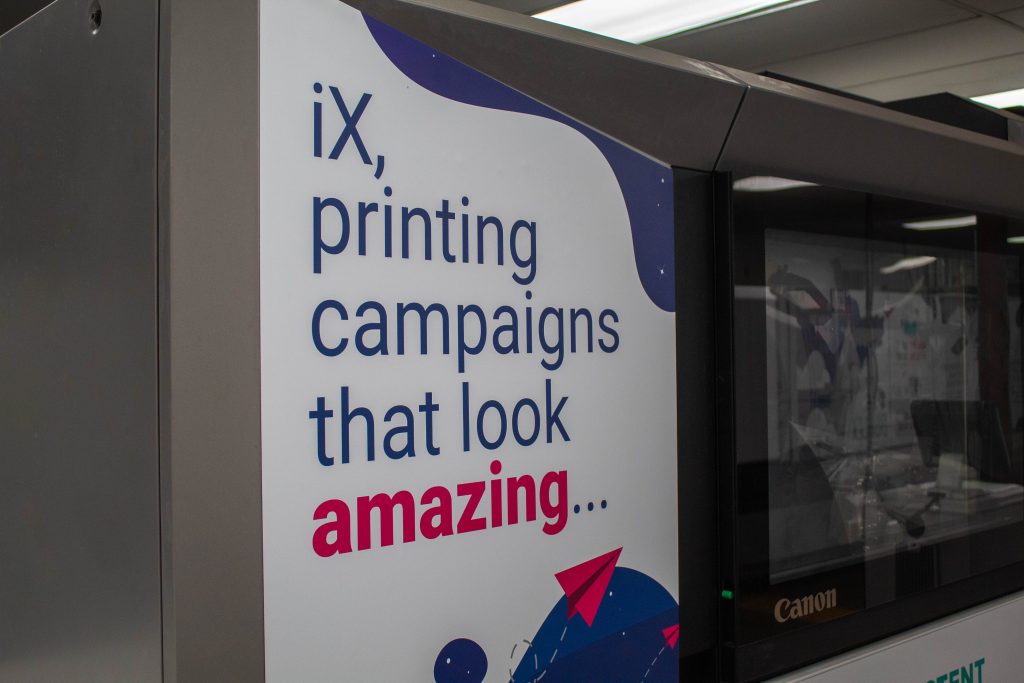 Close up of the Canon IX printer magnets saying "iX, printing campaigns that look amazing."