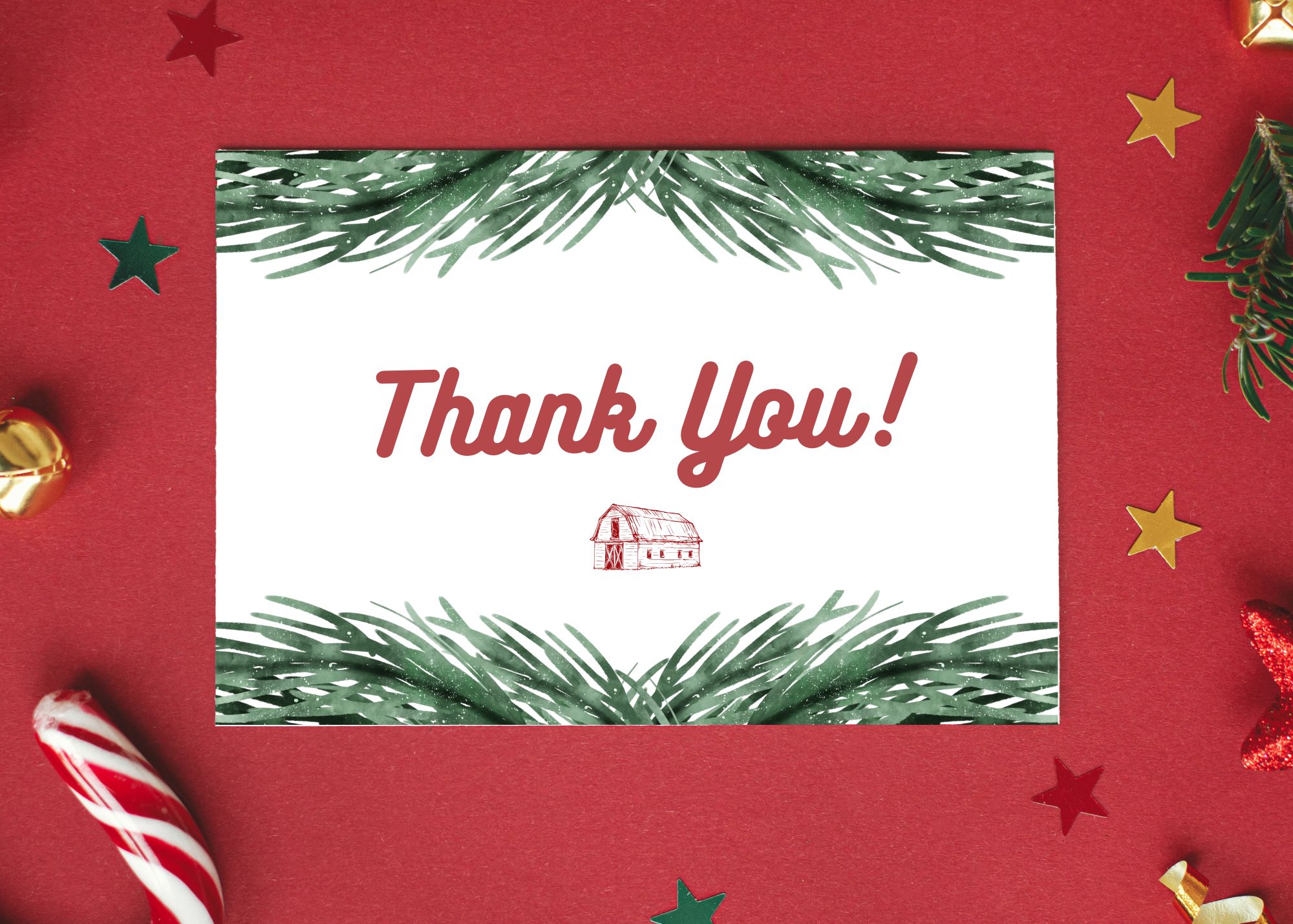 A winter themed thank you card sitting on a red background